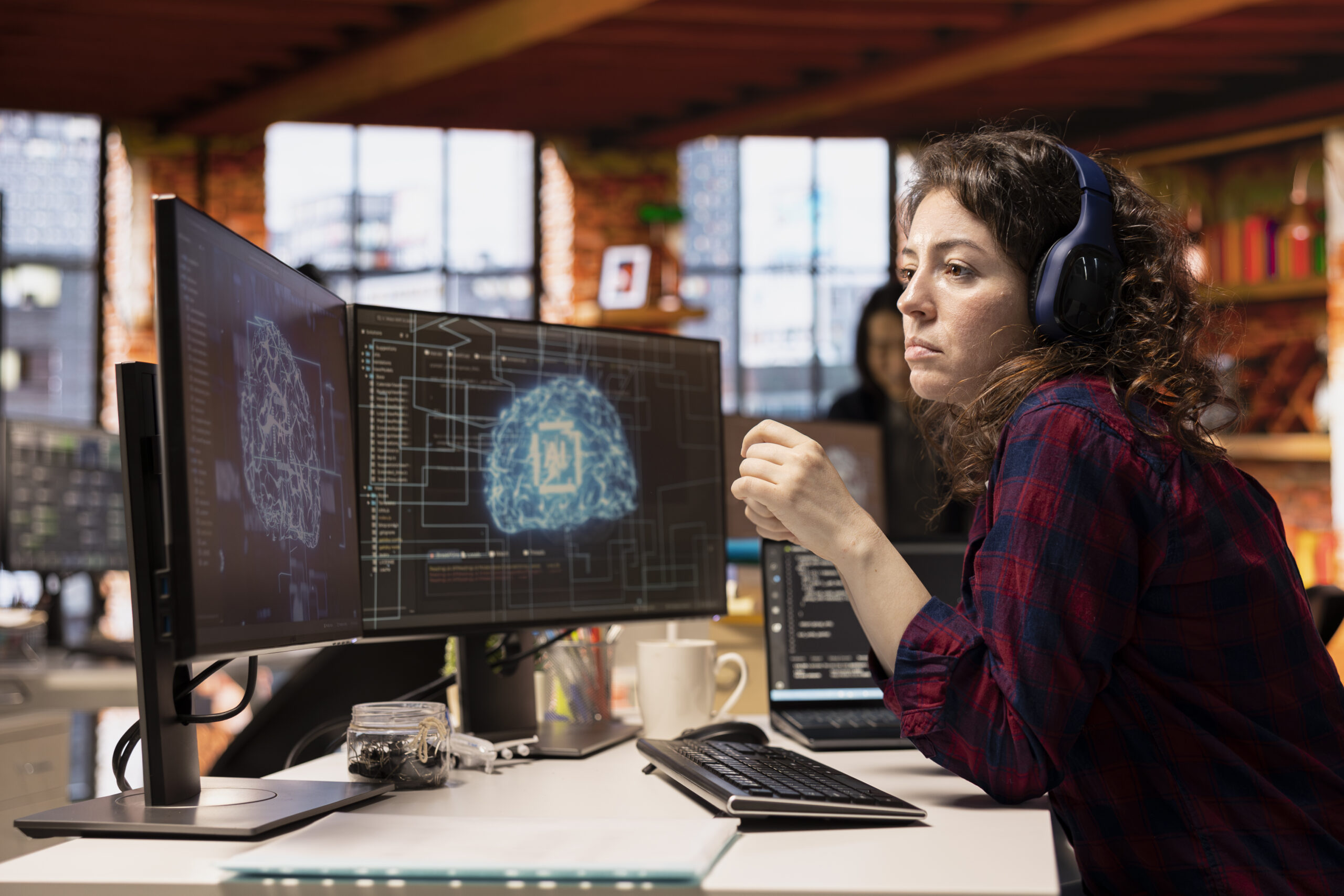 AI industry startup technician coding and listening podcasts in office